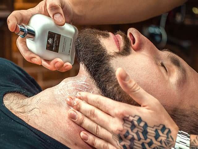 Royal shave in Topboy Barbershop: Applying of aftershave care